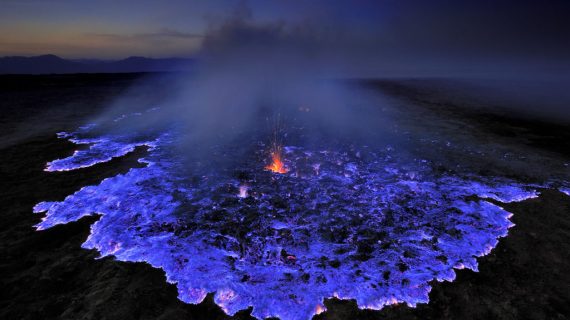 Sulphur dust contained in the soil of the hydrothermal site of Dallol flare up and discharge these characteristic electric blue flames, Ethiopia